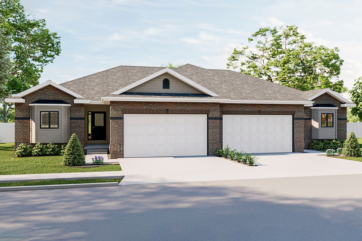 House plan exterior. One-story structure with brick facade. Features include a two-car garage, a gable roof, and small dormers above the windows.