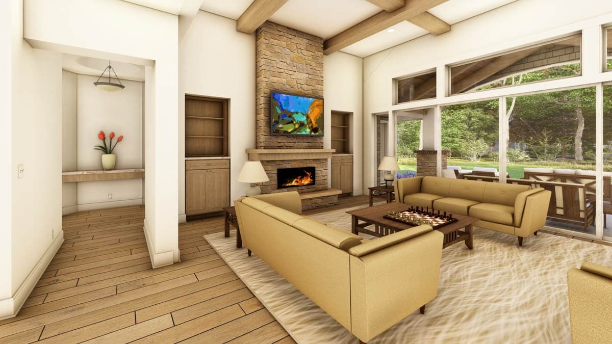 Interior rendering of a great room with a stone fireplace, vaulted beamed ceiling, and large windows overlooking an outdoor patio.