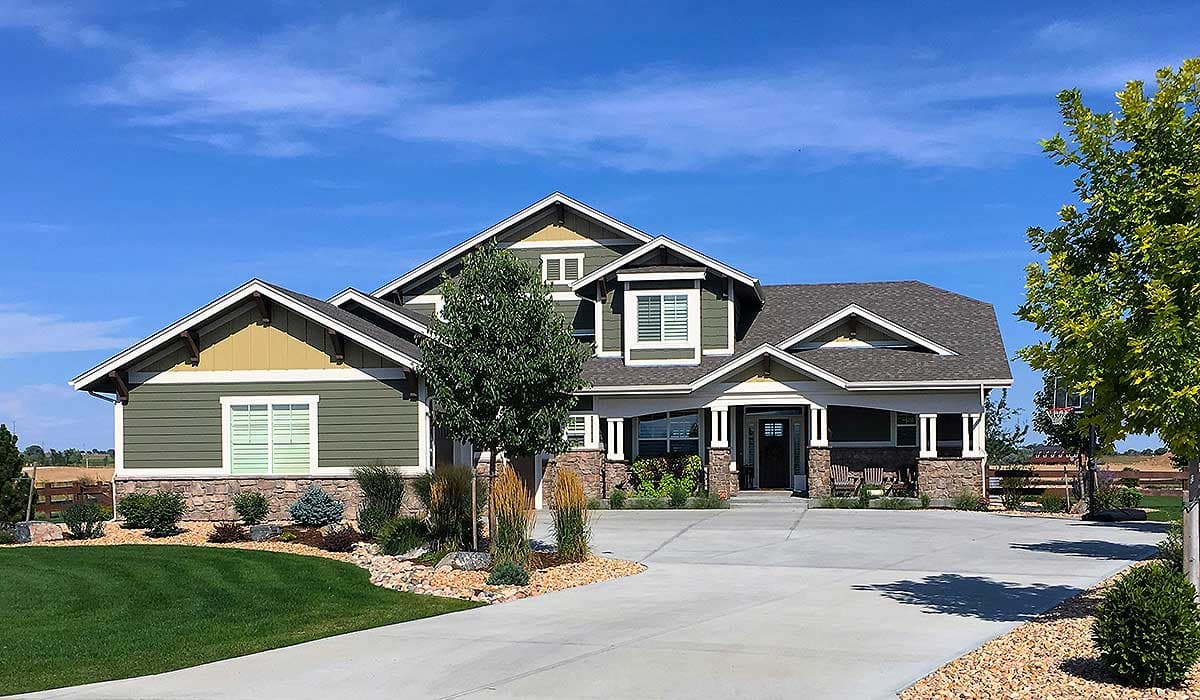 House plan exterior. Craftsman style, one story, with gabled rooflines, exposed rafter tails, and a covered porch.