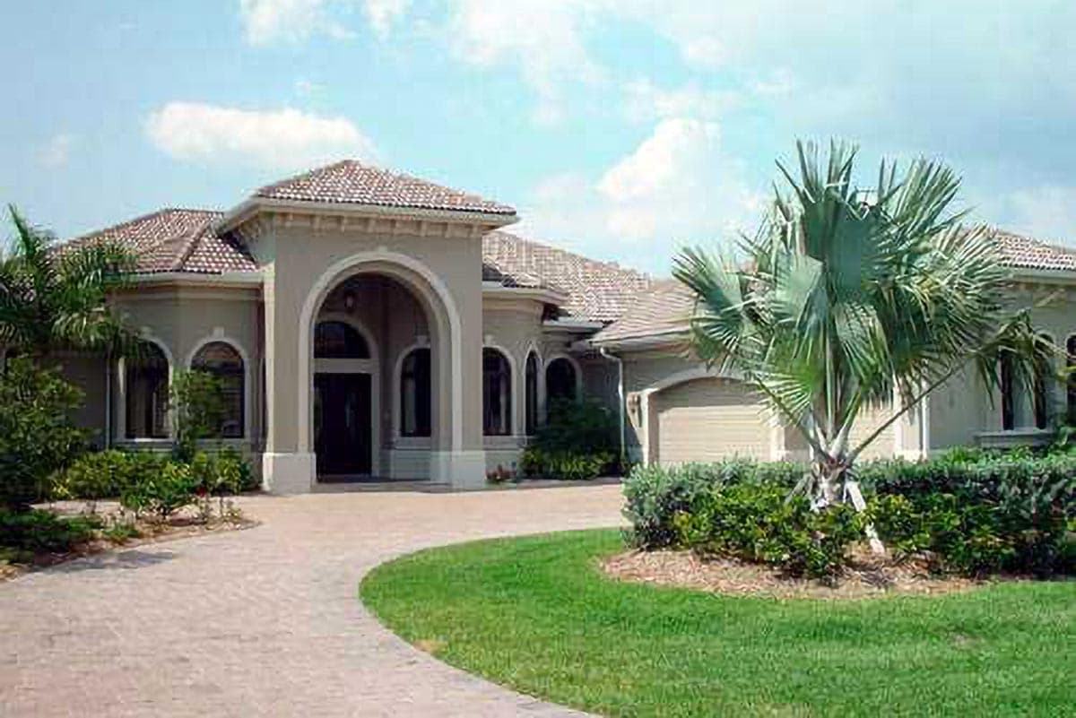 House plan exterior, one story, stucco, arched entryway, tiled roof, and side-entry garage.