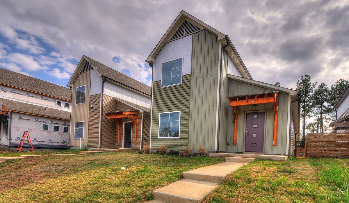 Two-story Modern Farmhouse style house plan exteriors with gabled roofs, contrasting siding, and exposed wood porch supports.