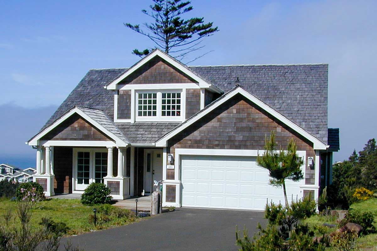 House plan exterior of a two-story home with shingle siding, a covered porch with columns, and a side-facing garage.