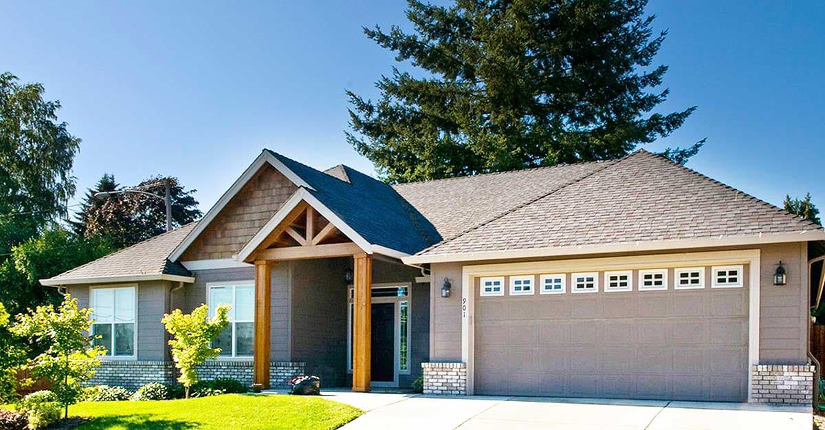 House plan exterior: Ranch style, one story, prominent gabled entry with wood detailing and a two-car garage.