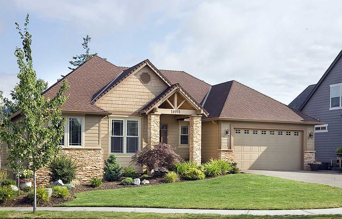 House plan exterior. Ranch style with a gabled roof, stone accents on the facade, and an attached garage with multiple windows.