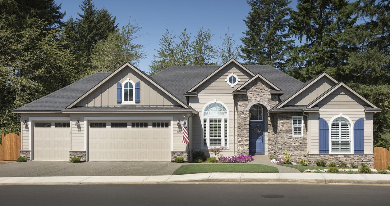 House plan exterior: one-story Modern Farmhouse with a three-car garage, stone accents, arched windows, and blue shutters.