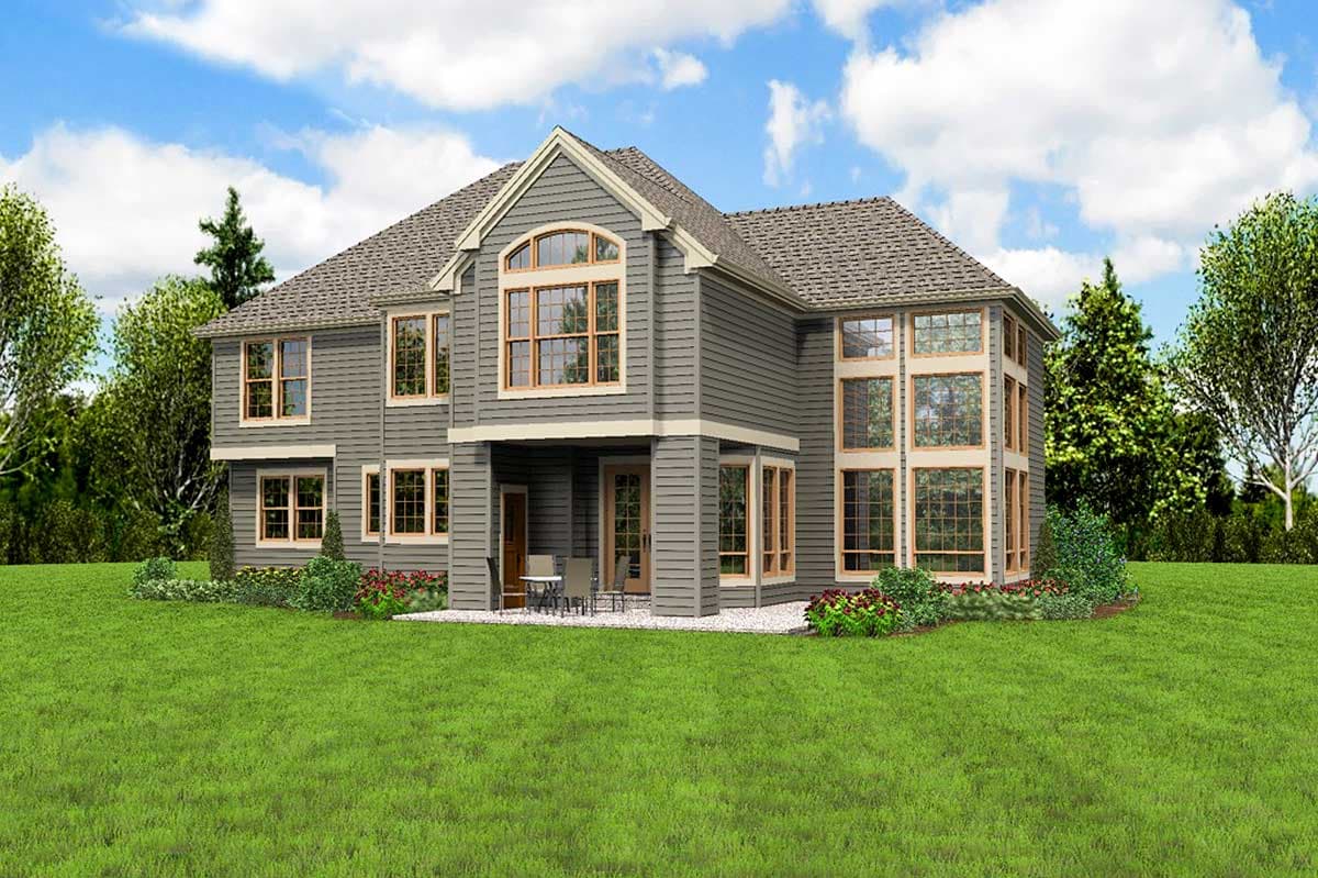 House plan exterior: Two-story gray home with multiple gables, a covered porch, and extensive multi-pane windows.
