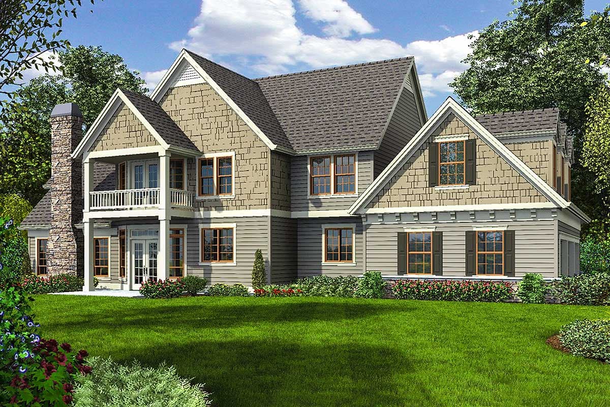 Two-story house plan exterior with stone chimney, second-story balcony, multiple gables, and varied siding.