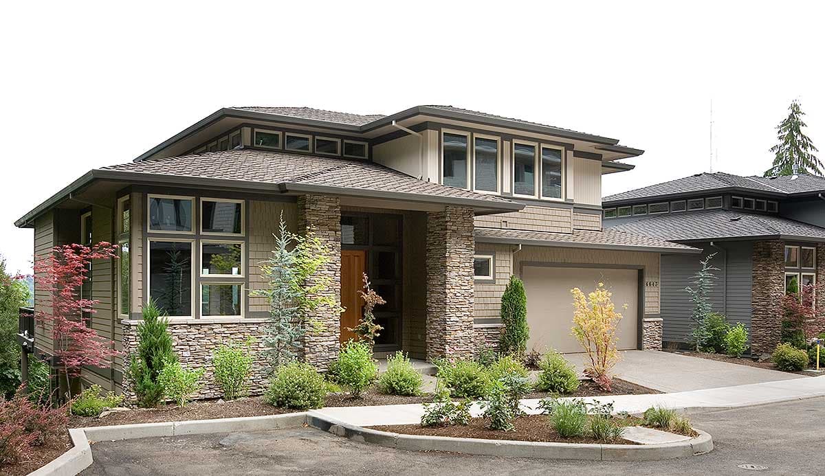 Modern house plan exterior featuring stone accents, layered rooflines, clerestory windows, and integrated garage.