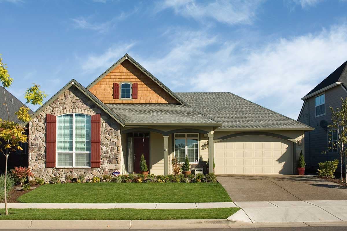 House plan exterior: One-story Modern Farmhouse with stone facade, arched window, cedar shingles, and attached two-car garage.