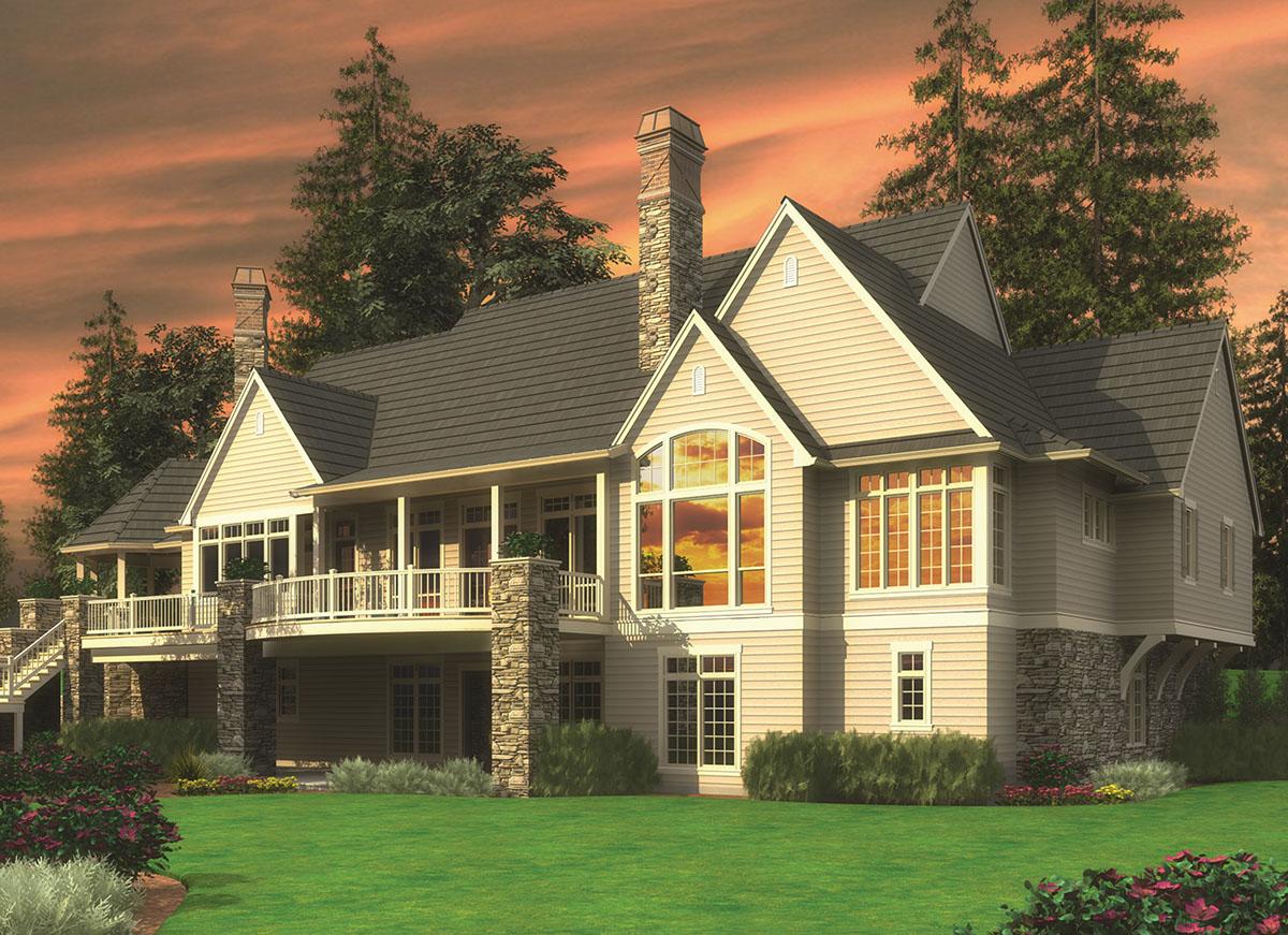 House plan exterior: Two-story home with a wraparound porch, stone accents, prominent gables, and arched windows.