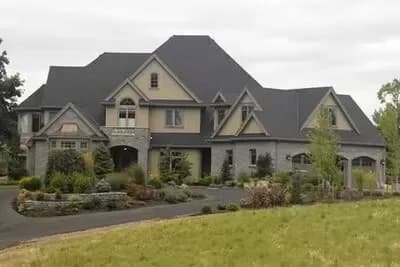 Large European Country Design with Angled Garage