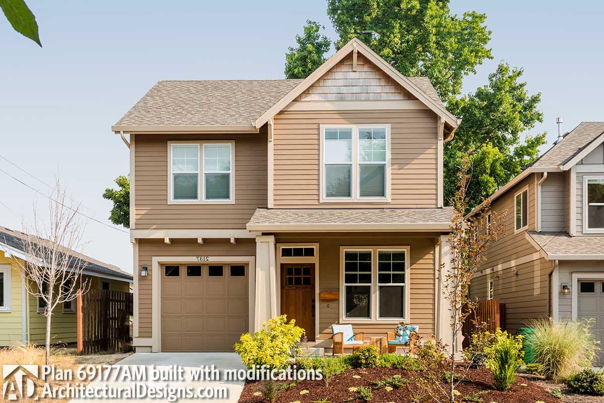 Two-story house plan exterior with horizontal siding, a gable roof, front-facing garage, and covered entry.