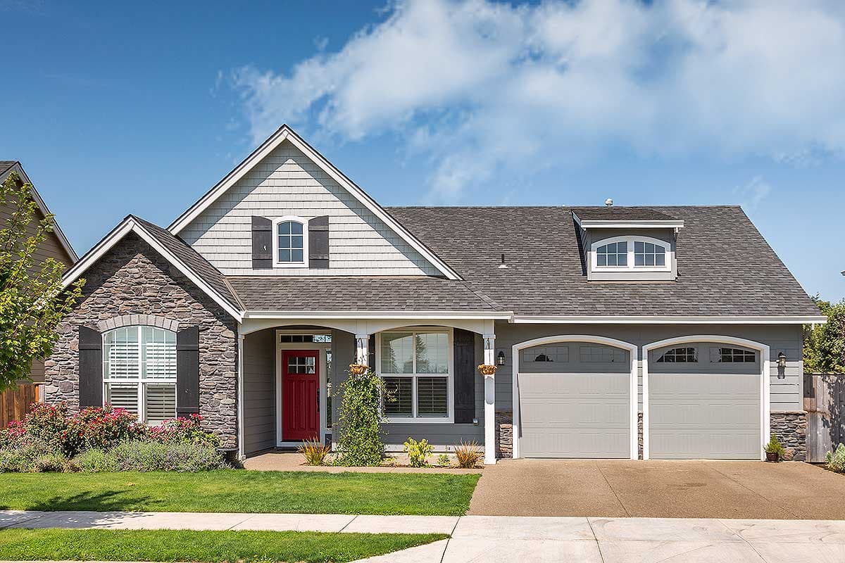 House plan exterior with stone accent, red front door, gable dormer, and double garage.