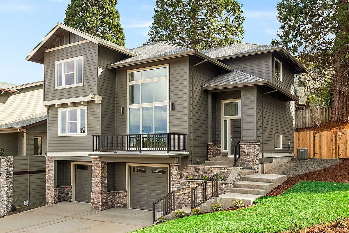 House plan exterior. Two-story, Modern style home with a balcony, stone accents, and a low-slope roof. Attached garage.