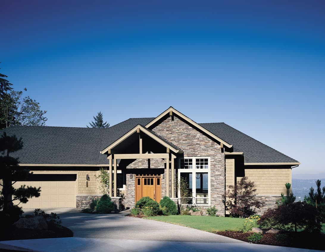 House plan exterior: Ranch style home with stone facade, covered entry with wood beams, and a two-car garage.