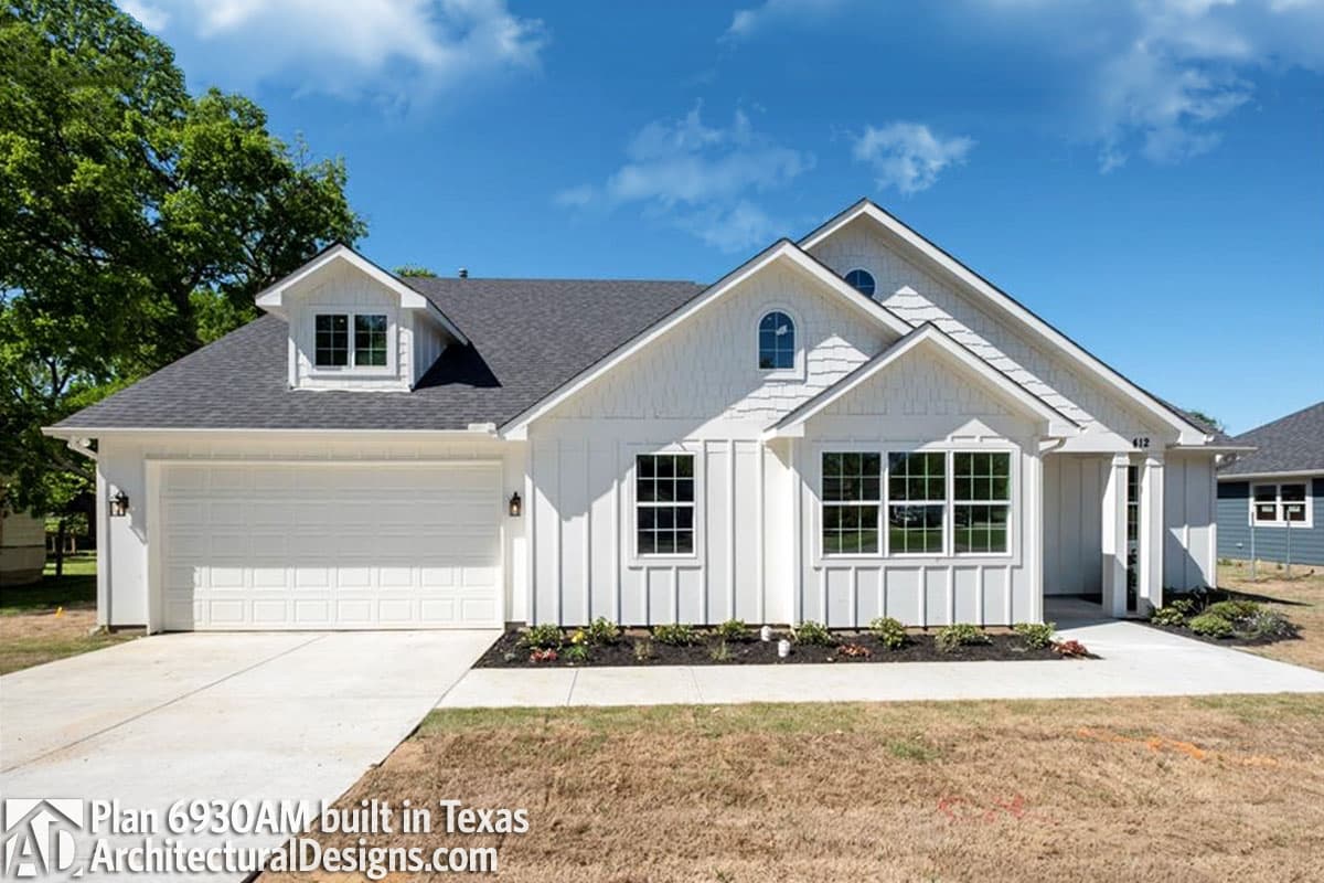 House plan exterior of a modern farmhouse-style home with a 2-car front-facing garage, gables, and dormer windows.