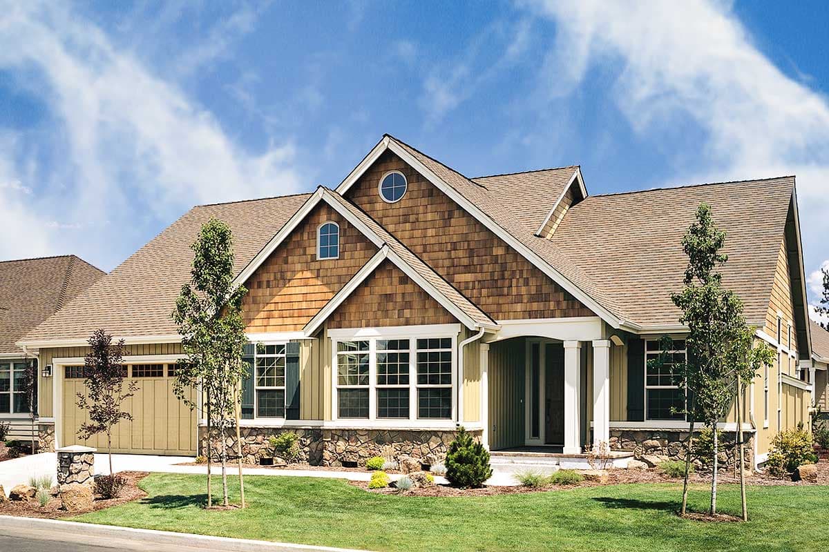 House plan exterior featuring Craftsman style, single-story, with gables, stone accents, and a front porch with columns.