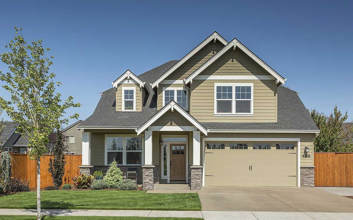 House plan exterior: Two-story home with dormers, gables, covered entry, and attached two-car garage.