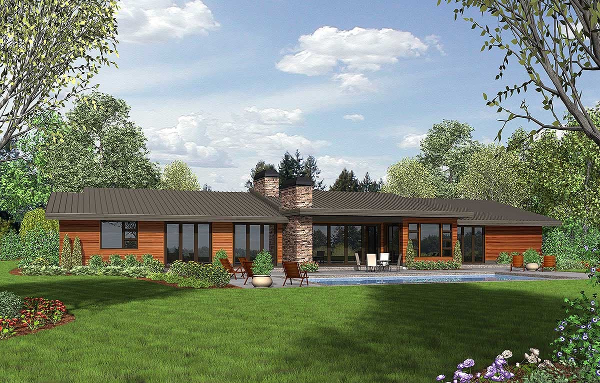 Modern ranch house plan exterior with a metal roof, stone chimney, and extensive glass doors opening to a patio and pool.