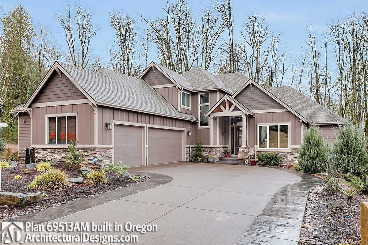 House plan exterior: Modern home with stone and board-and-batten siding, dual garage doors, gable roof, and covered entry.