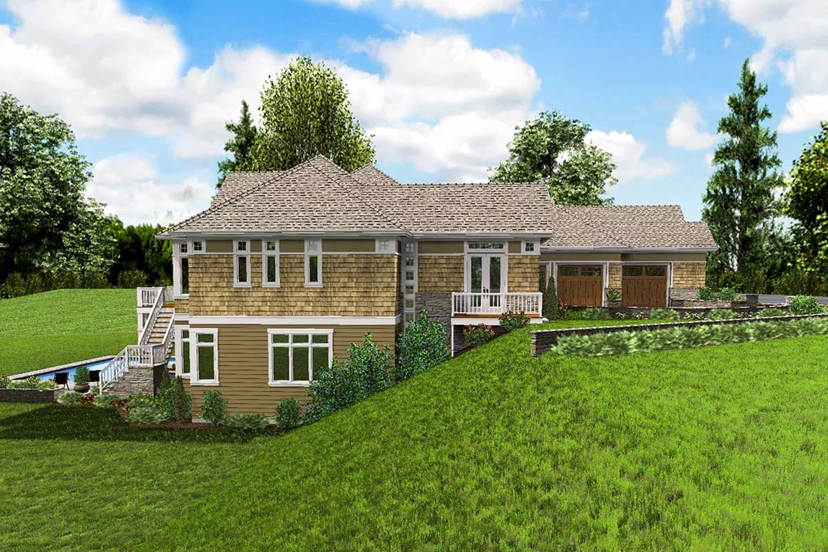 House plan exterior, two stories, shingle siding, multiple gables, white railings, and a three-car garage.