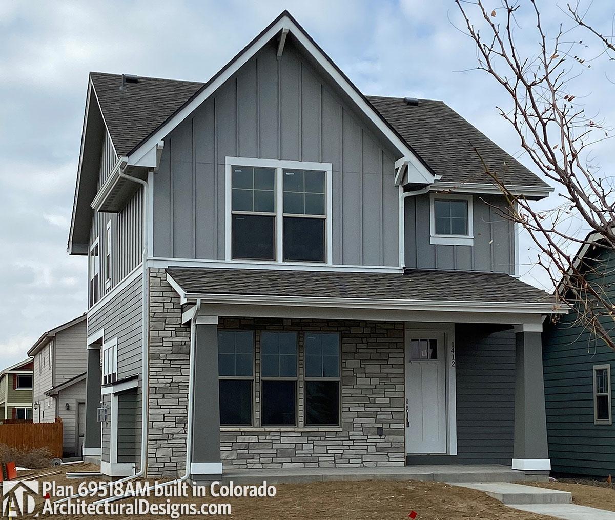 House plan exterior: two-story Modern Farmhouse with stone accents, board-and-batten siding, and a covered front porch.
