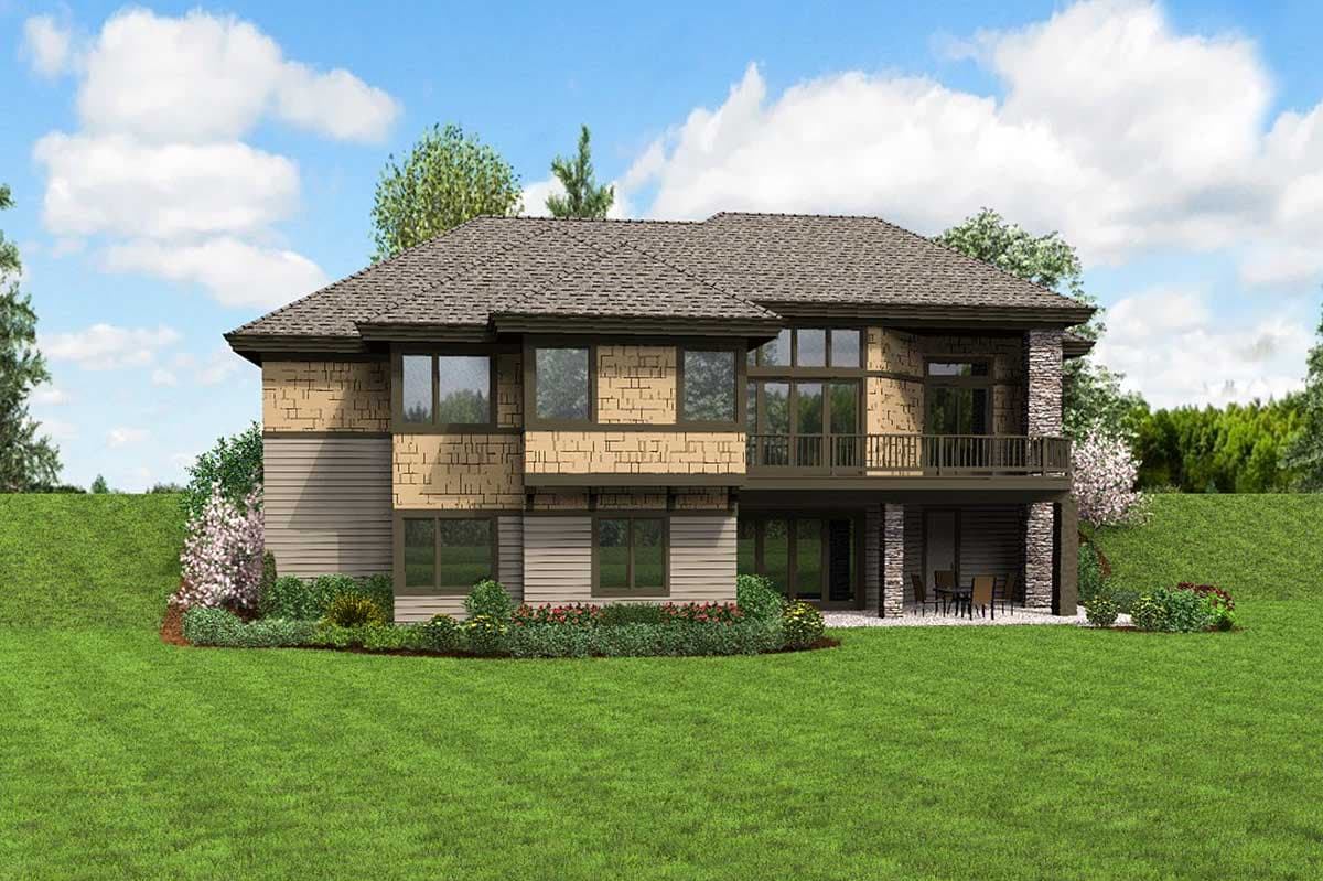 House plan exterior with multiple gables, stone accents, a second-story balcony, and large windows.