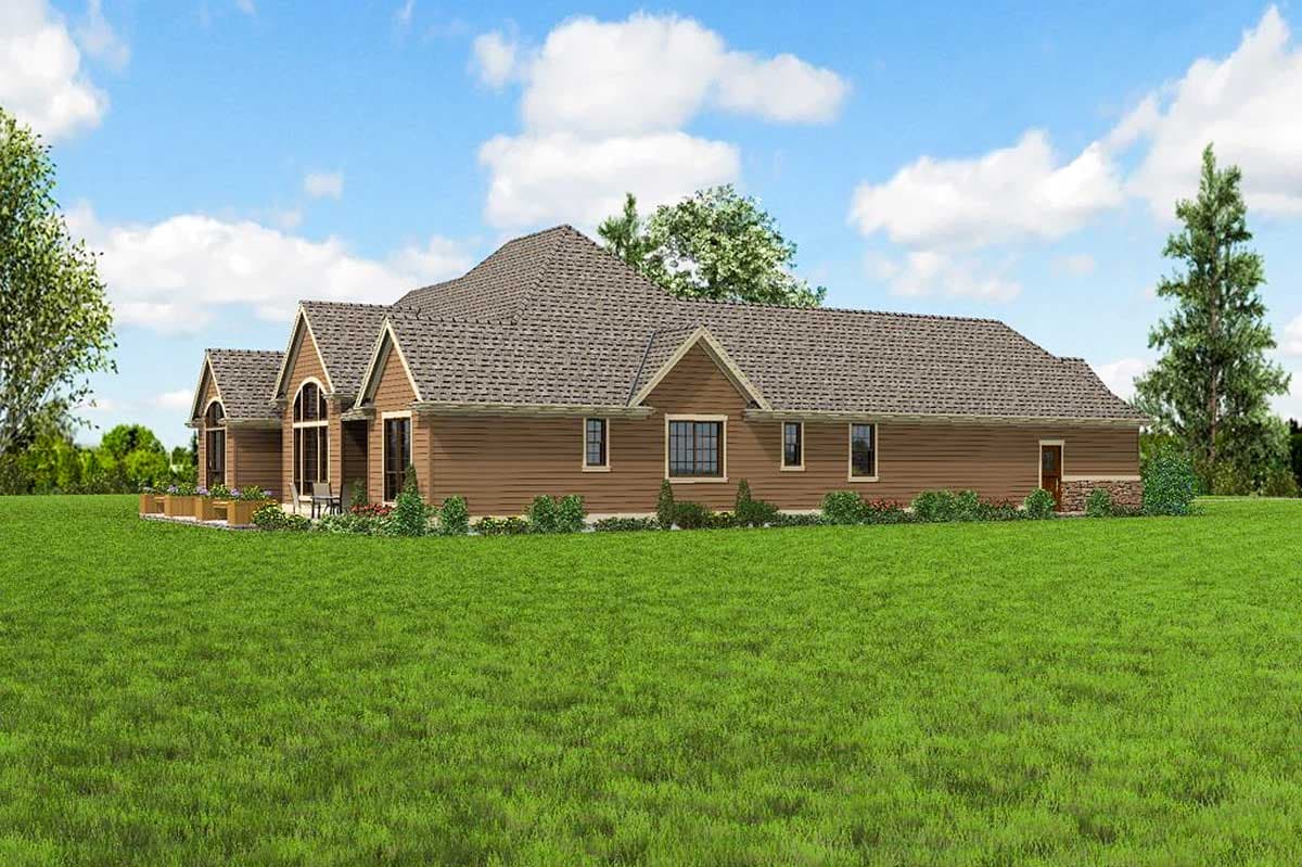House plan exterior featuring a long, single-story design with multiple gables, arched windows, and horizontal siding.