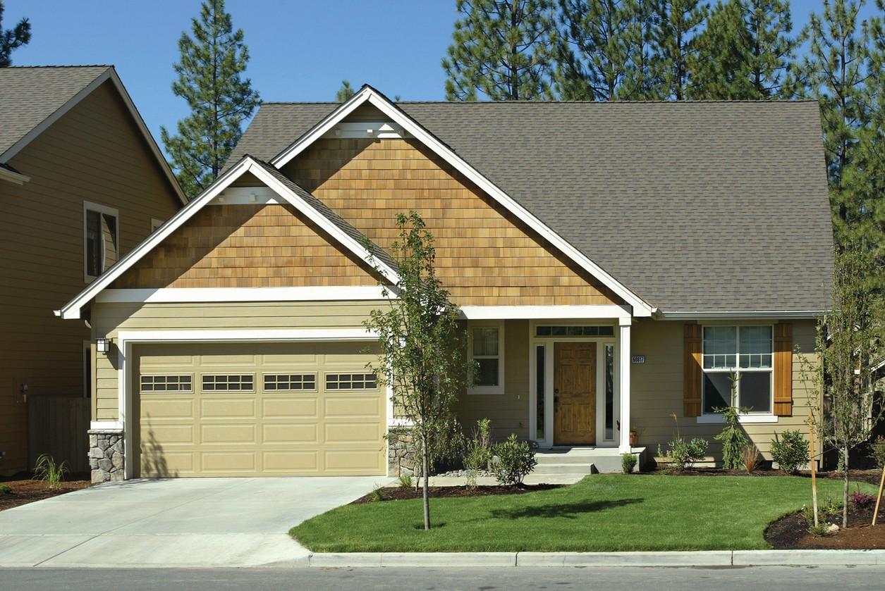 Modern Farmhouse house plan exterior with side-entry garage, prominent gable with cedar shakes, and covered front porch.