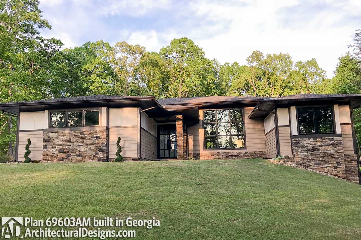House plan exterior shows a one-story Modern style home with stone and horizontal siding, large windows, and an elevated entryway.