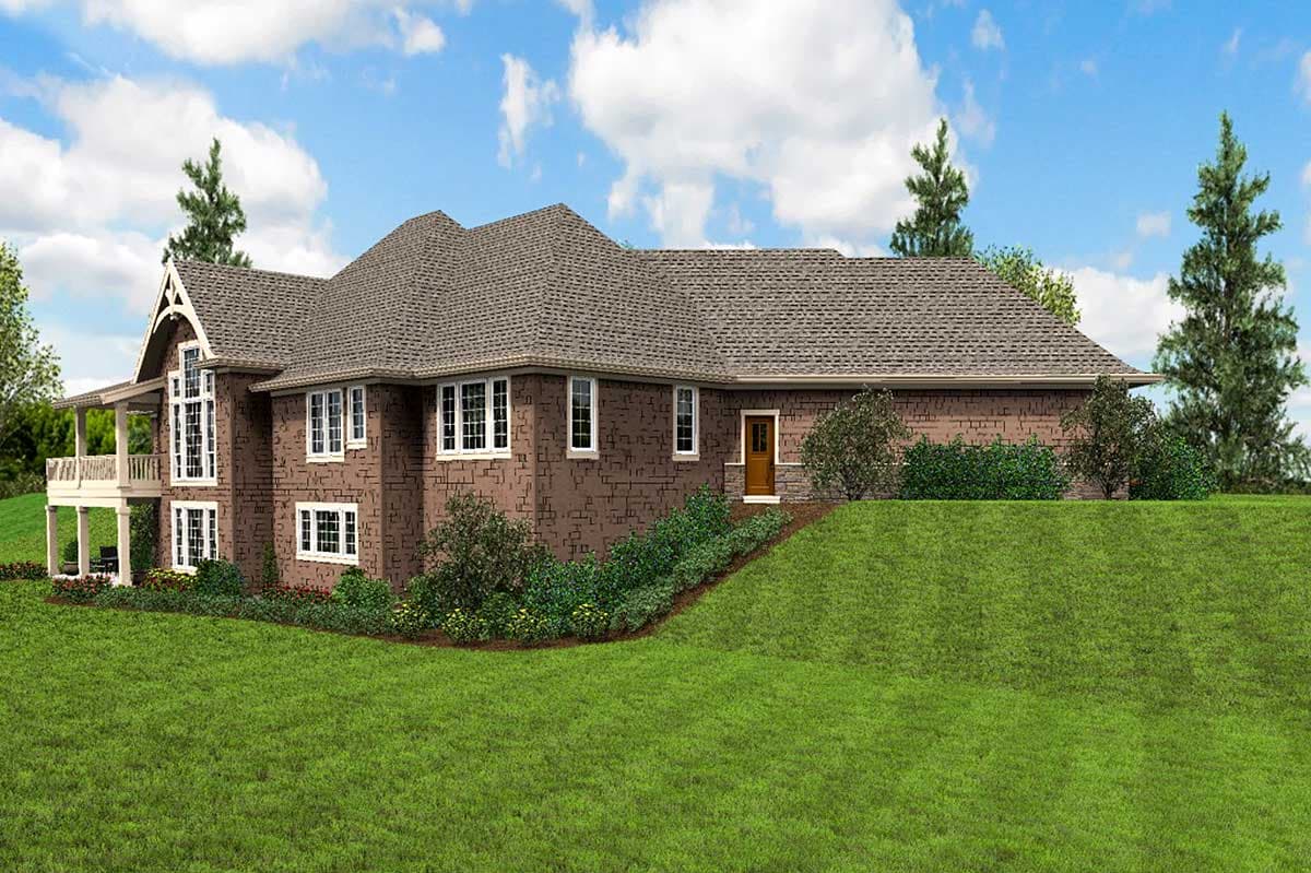 House plan exterior showing a multi-story brick home with a prominent gable, large windows, and a covered porch.