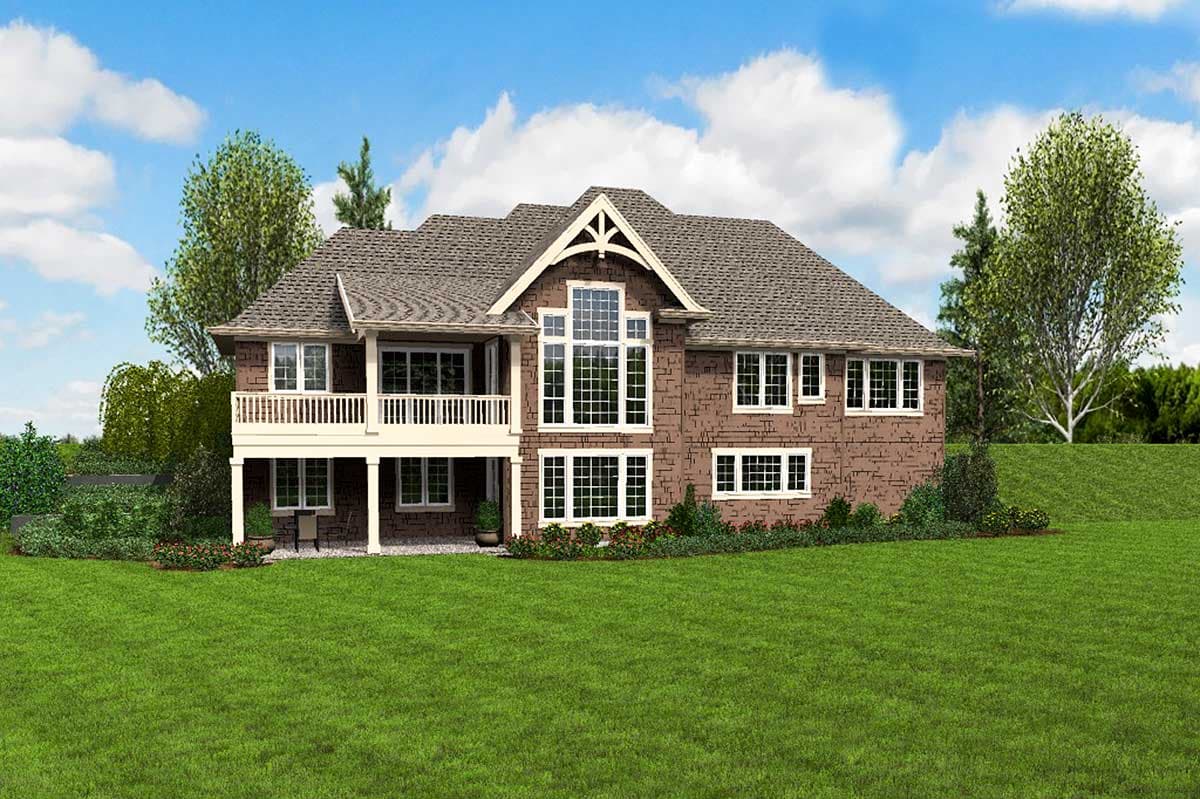 House plan exterior: Two-story home with white railing porch, prominent gable with large window, and brick facade.