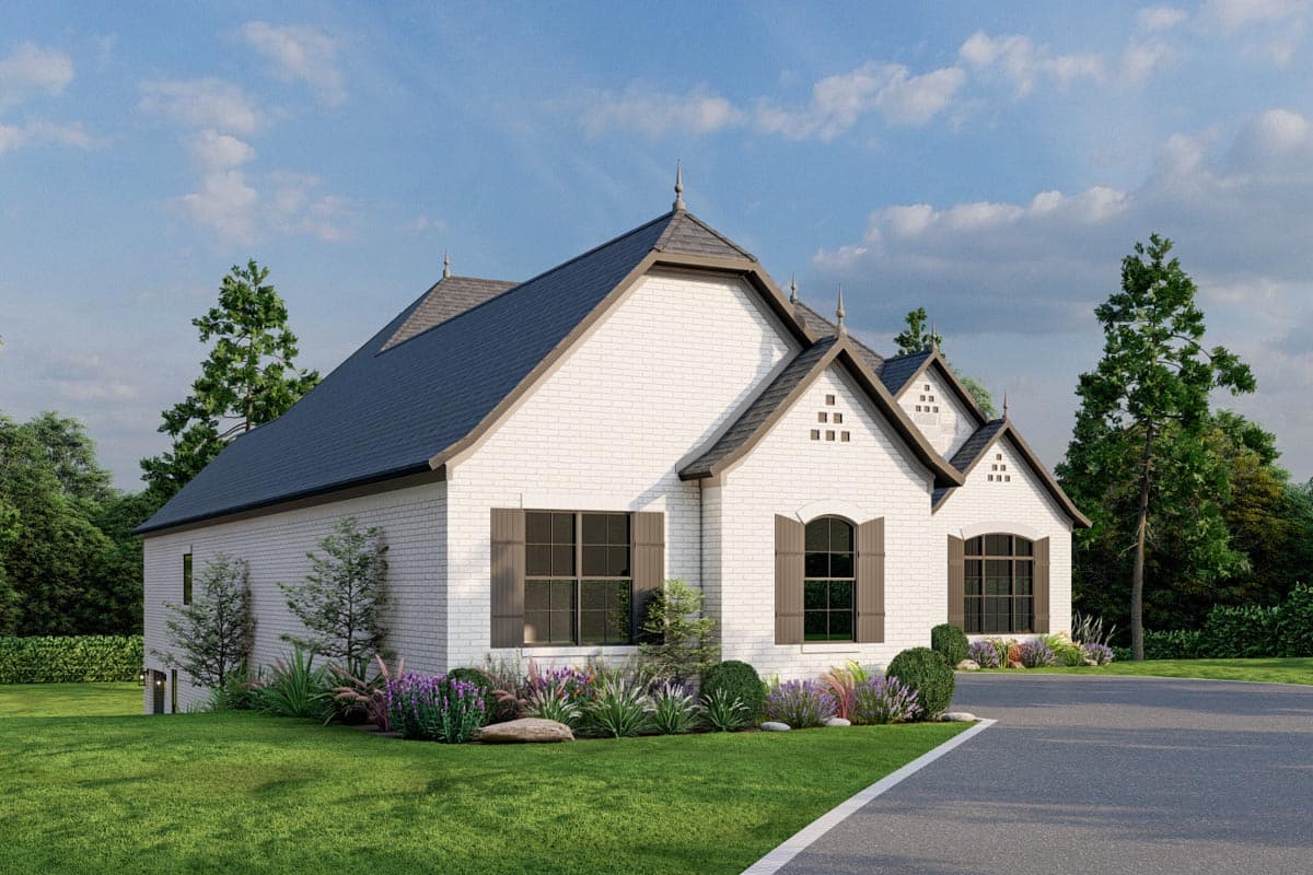 House plan exterior: A one-story home with white brick, dark roof, multiple gables, and decorative finials.