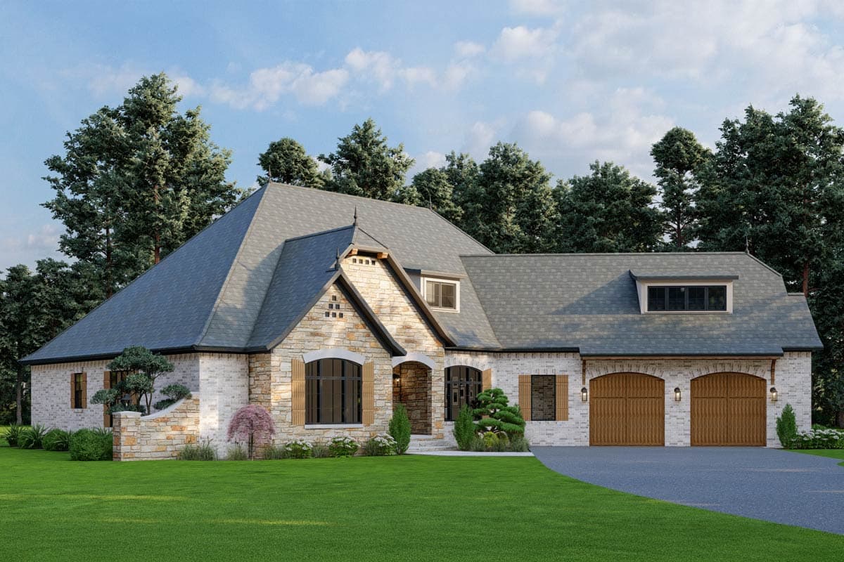 House plan exterior: One-story home with stone and brick facade, prominent gable, arched entryway, and three-car garage.