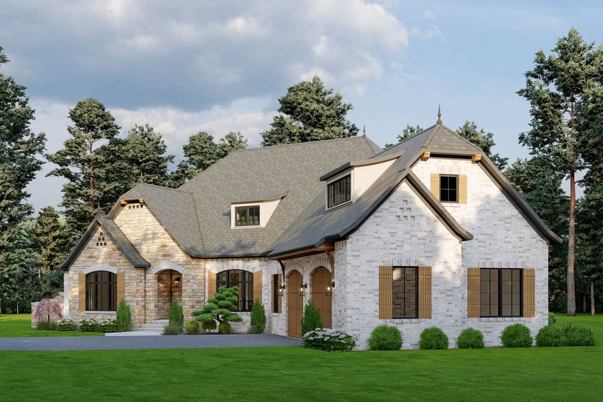 House plan exterior features stone and white brick facades, arched entry, multiple gables, dormers, and double garage doors.