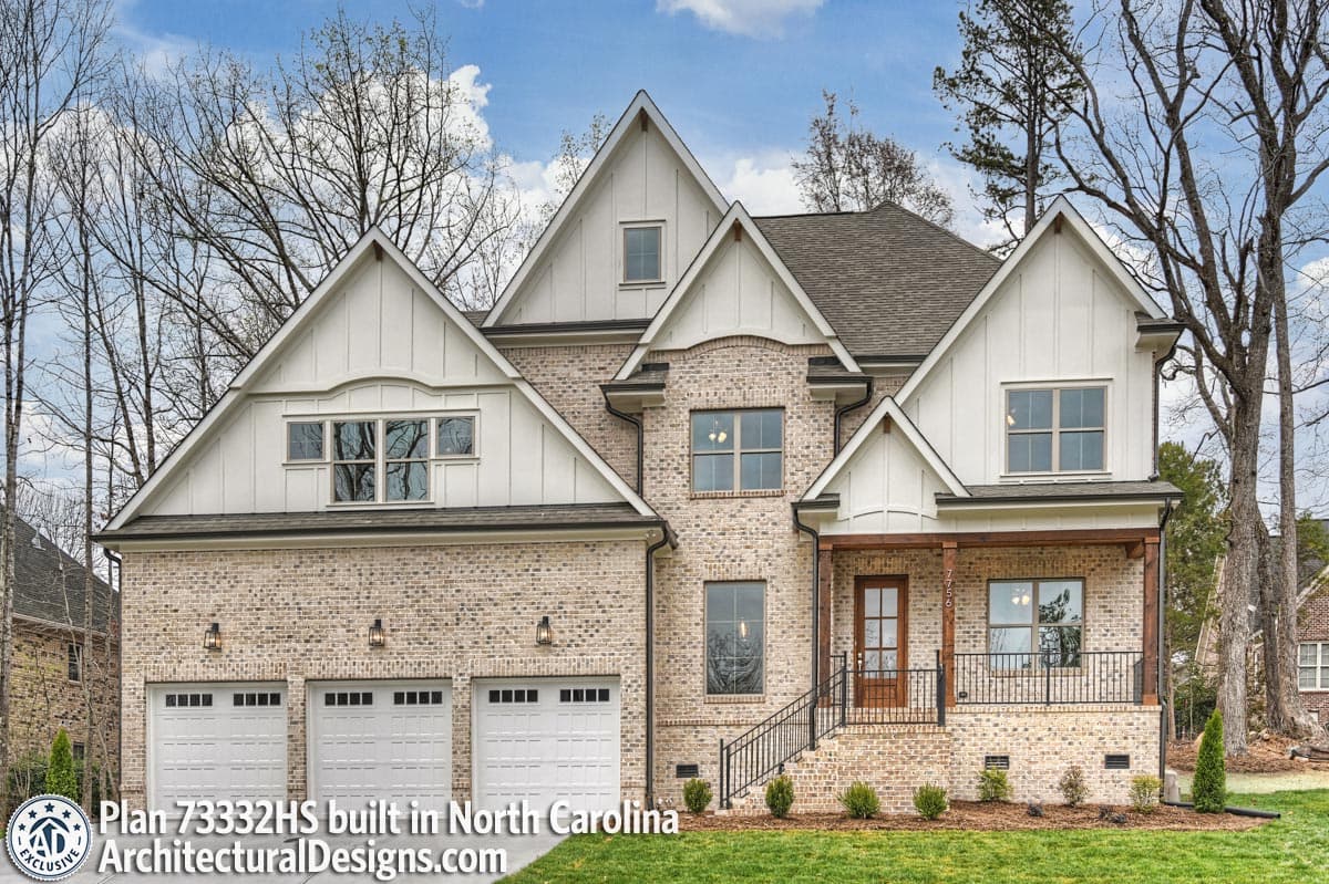 House plan exterior: Two-story Modern Farmhouse with three-car garage, gabled dormers, and covered front porch.