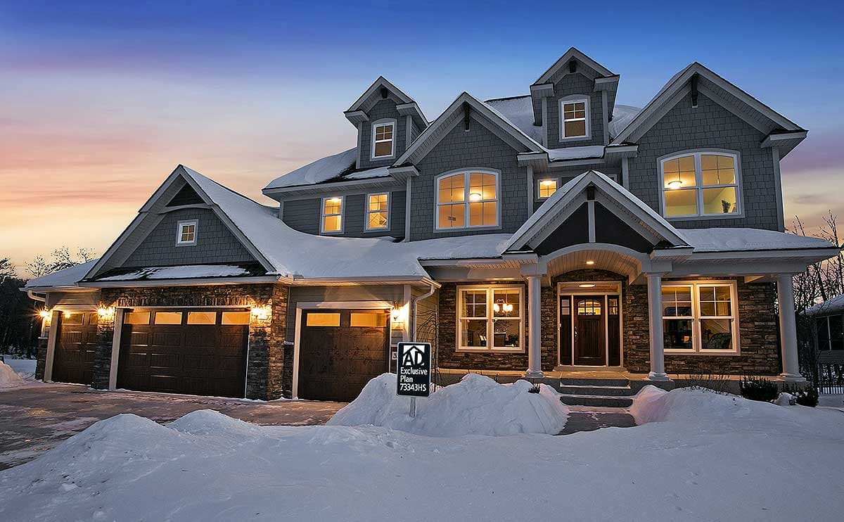 House plan exterior: Two-story home with multiple gables, dormers, stone accents, and a covered entry porch.