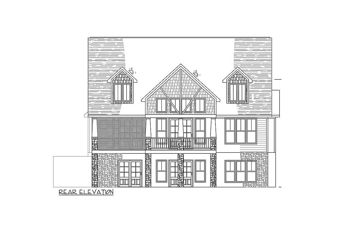 Rear elevation drawing of a multi-story house plan featuring dormers, a balcony, and stone accents.