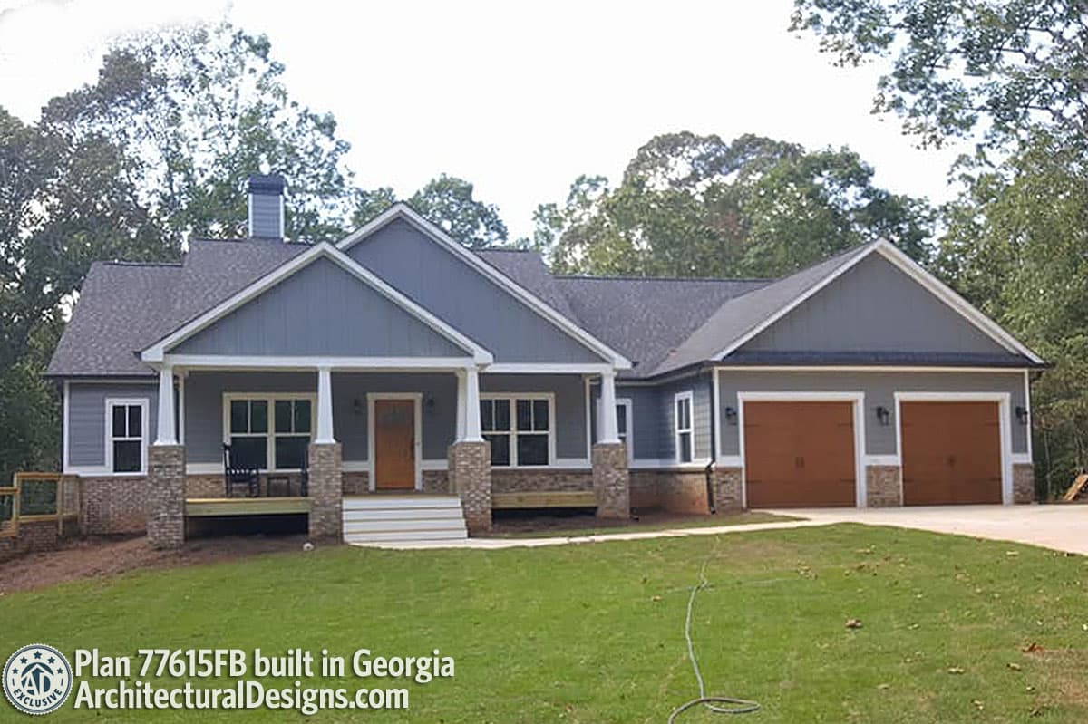 House plan exterior: One-story Modern Farmhouse with covered front porch, gables, and a three-car garage.