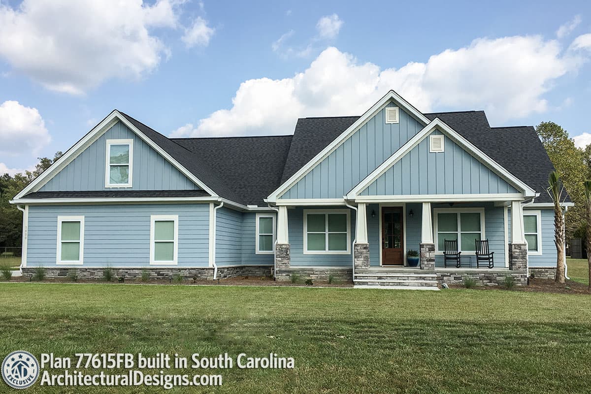 House plan exterior: one-story Modern Farmhouse with gabled dormers, stone accents, and covered front porch.