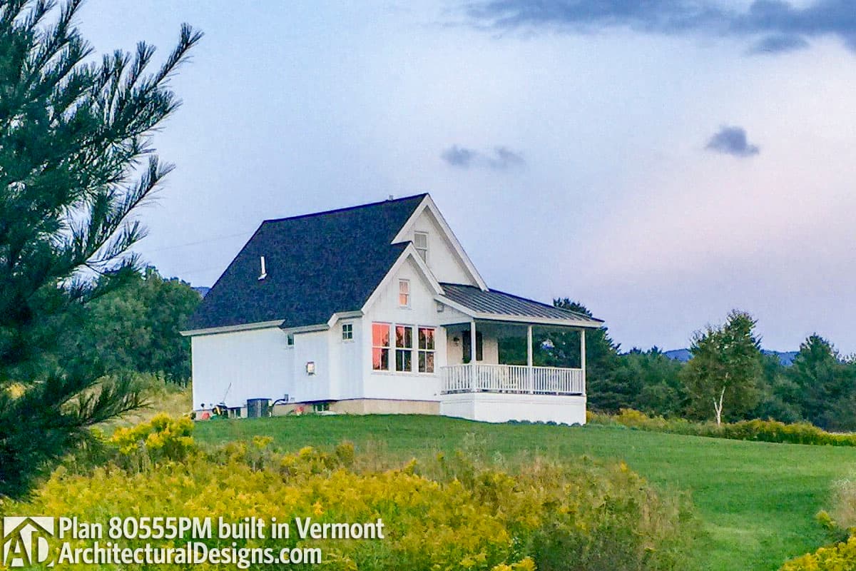 House plan exterior: One-story Modern Farmhouse with a covered front porch, prominent gable, and large bay window.