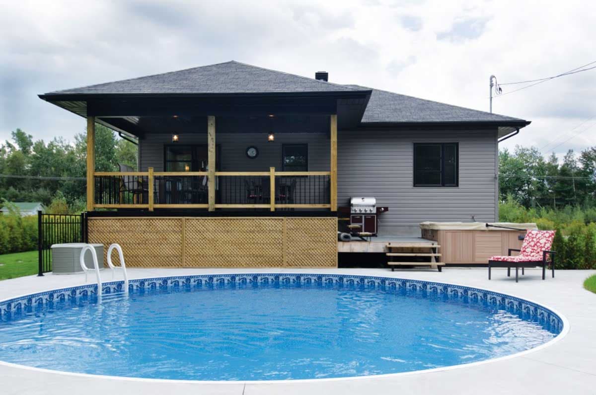 House plan exterior: One-story home with covered deck, asphalt shingles, and attached jacuzzi.