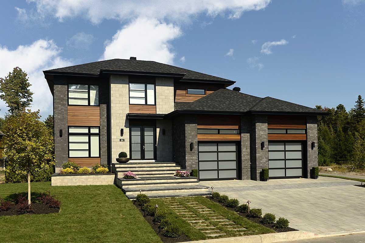 Modern two-story house plan exterior with stone, wood siding, double garage doors, and a prominent front entrance.