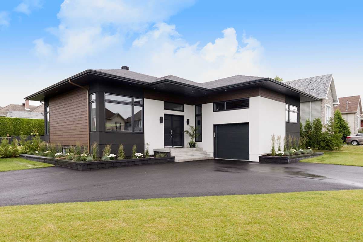 House plan exterior. Modern style, one-story home with flat roof, attached garage, and large windows. Features wood siding and dark trim.