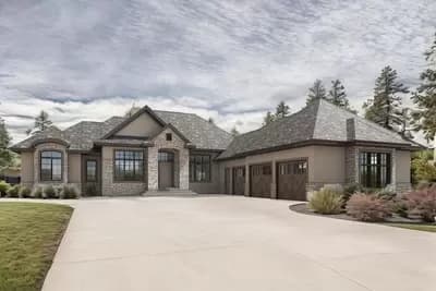 Stone-and-Stucco House Plan with Three-Season Room and Finished Lower Level
