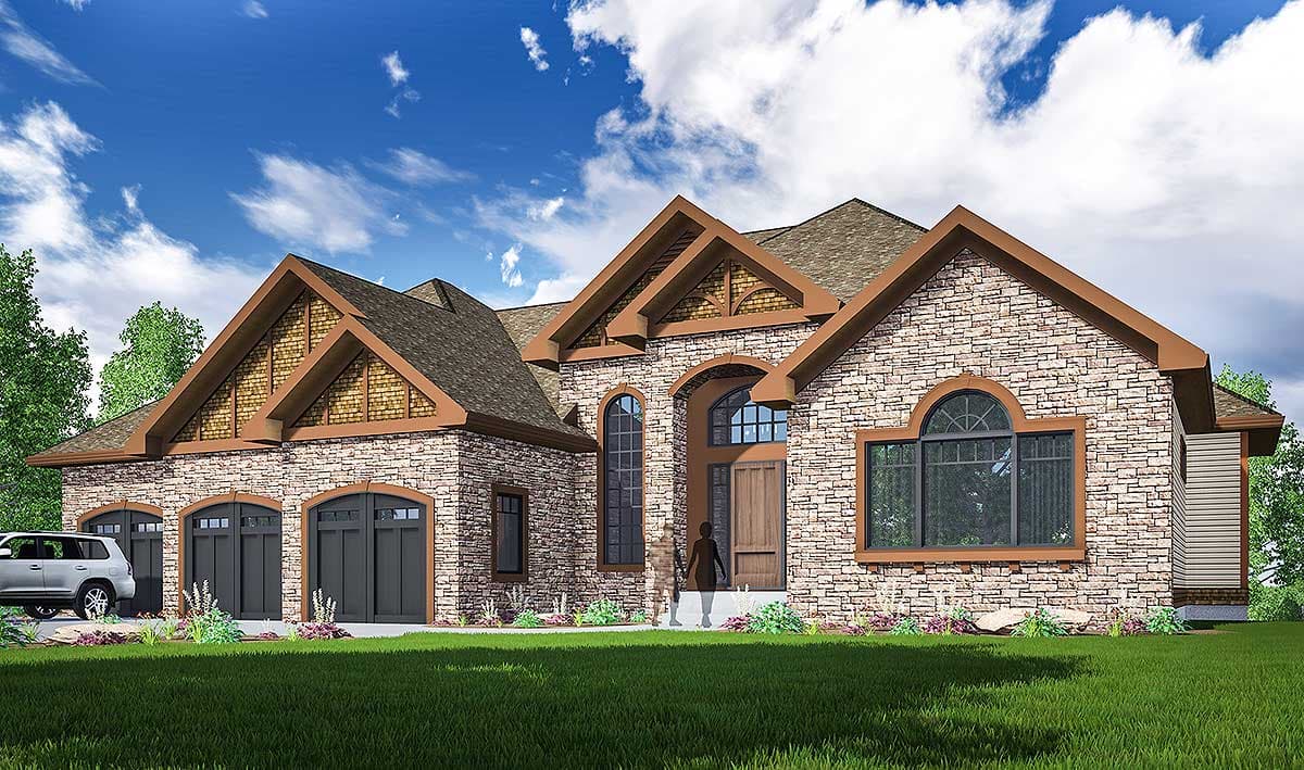 House plan exterior: Stone facade, prominent gables with decorative truss details, arched windows, and a three-car garage.