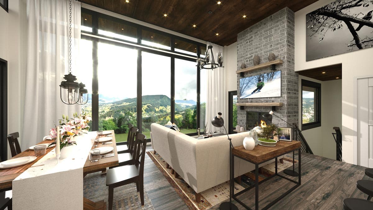Open-concept living and dining area with vaulted wood ceiling, large windows, and stone fireplace.