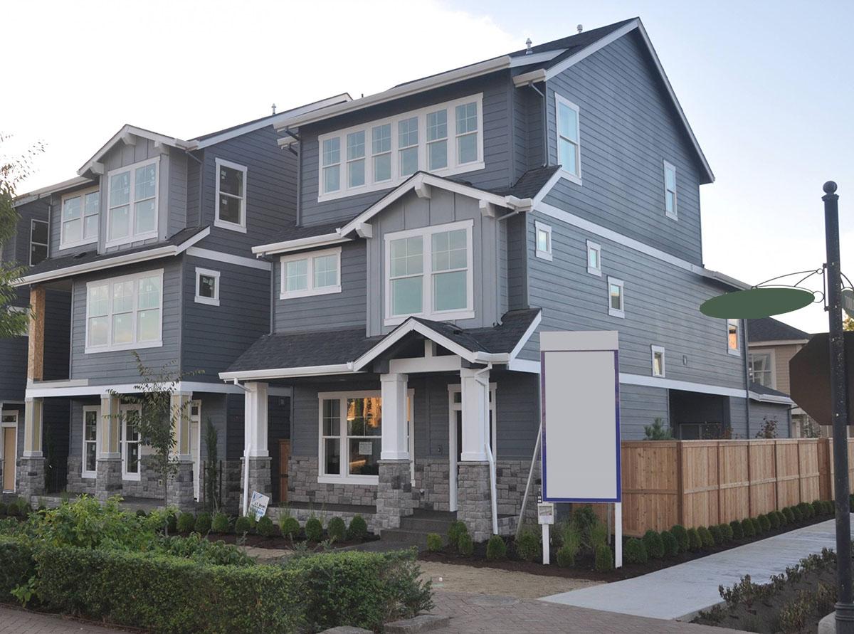 House plan exterior of three-story townhomes with stacked gables, covered entry, and multiple window arrangements.