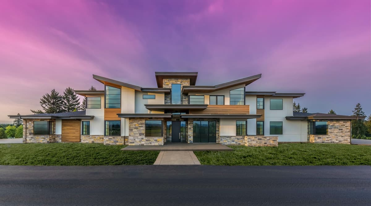 House plan exterior. Modern style with flat and angled rooflines. Features include stone veneer, large windows, and an entrance with a covered porch.