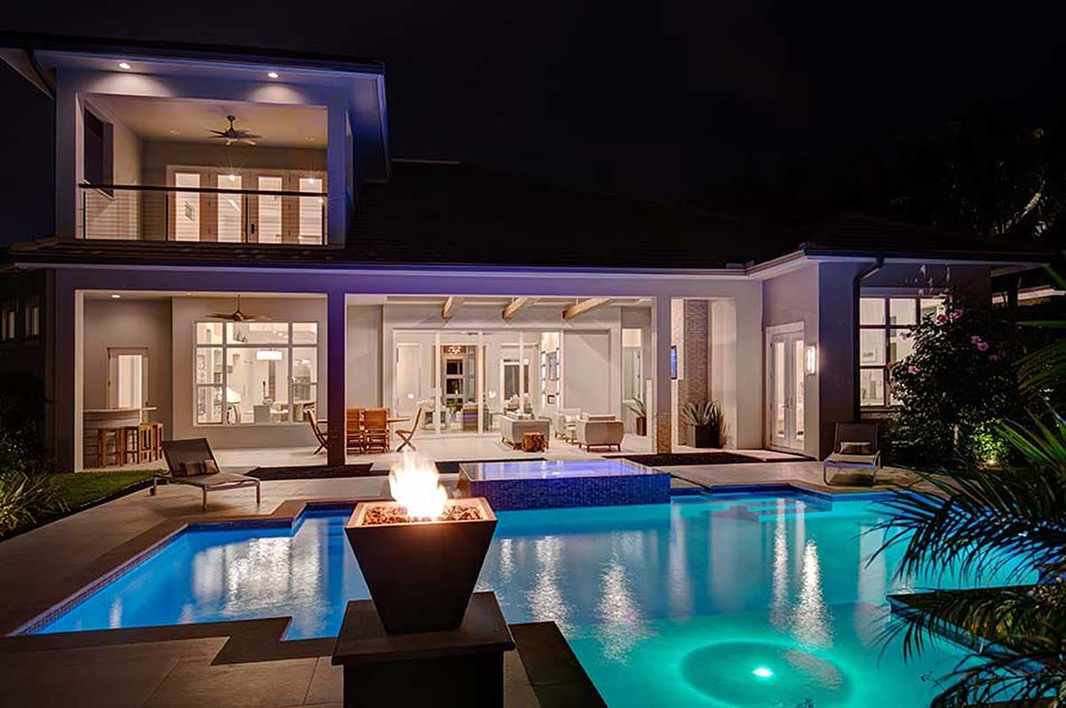 Modern two-story house plan exterior with a pool, spa, and covered patio.